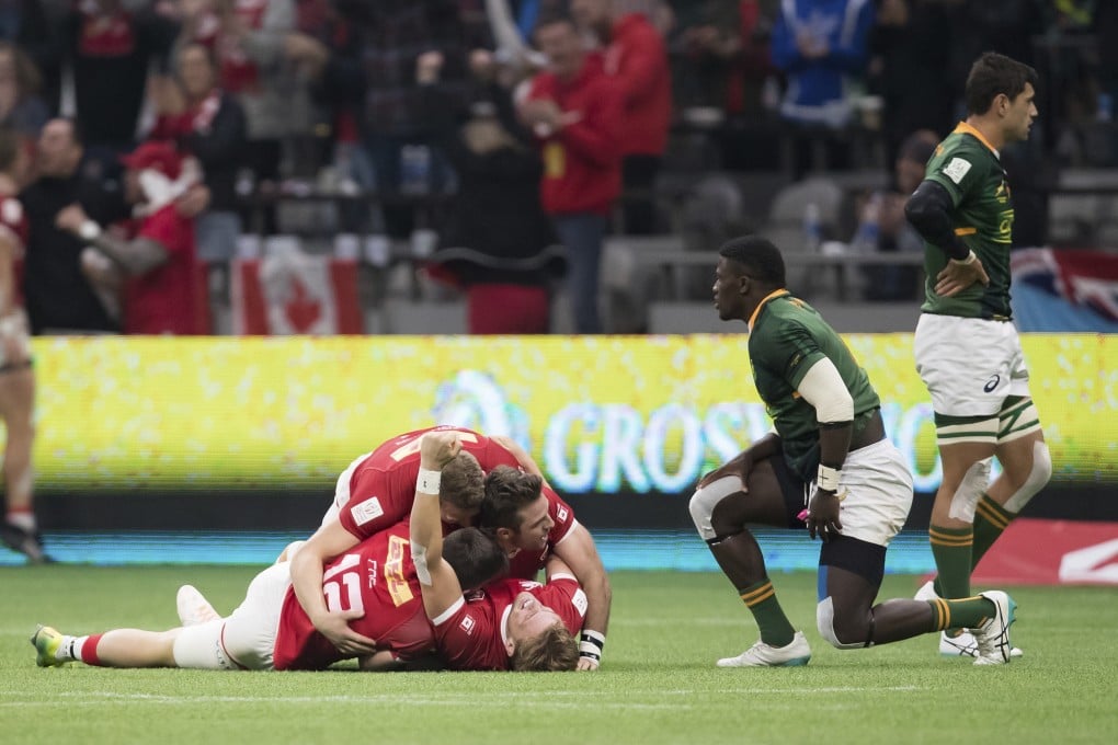 Canada’s Jake Thiel is mobbed by his teammates after Canada defeated South Africa in the bronze medal match at the Canada Sevens. Photo: AP