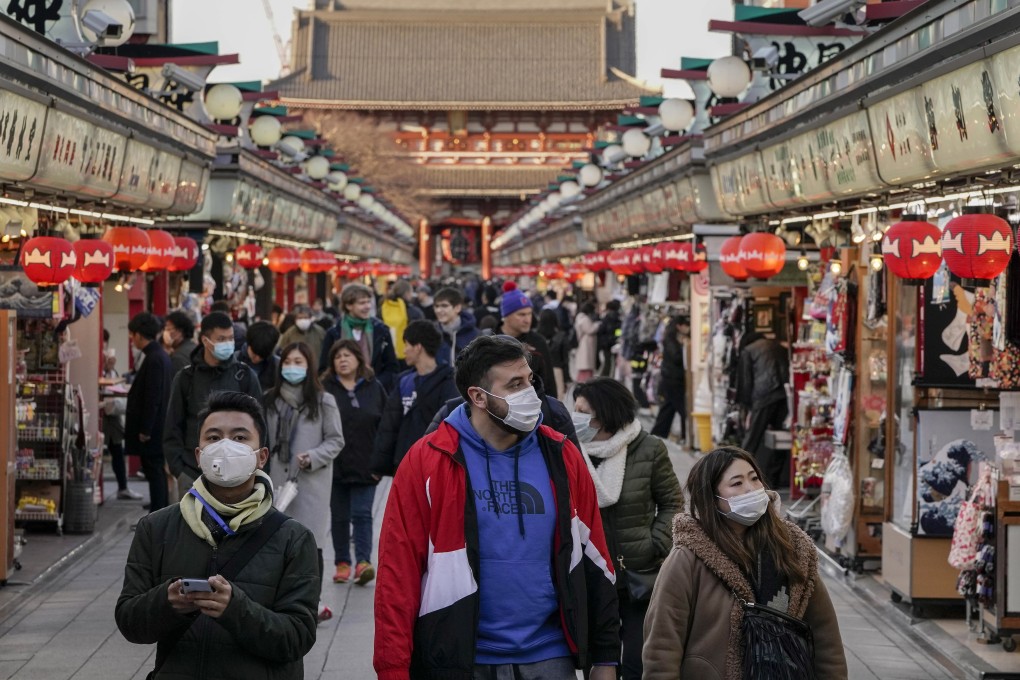 Tourists wearing masks seen in the Asakusa district of Tokyo, Japan, March 5, 2020. Overseas Chinese can use AliPay to get free online consultations with doctors in mainland China. Photo: EPA-EFE