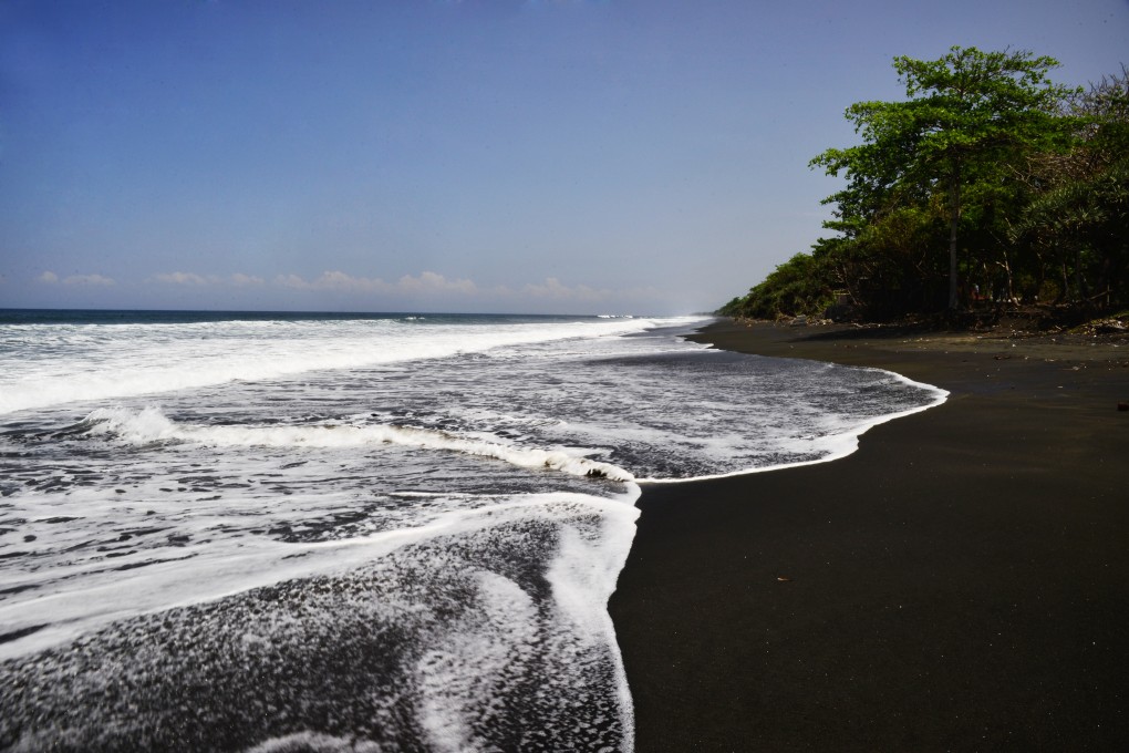 Jet-black volcanic sand on a typically deserted west Bali beach. Photo: Mark Eveleigh