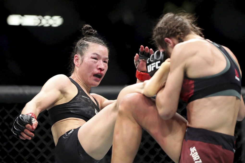 UFC women’s strawweight champion Zhang Weili kicks Joanna Jedrzejczyk during UFC 248. Photo: AP