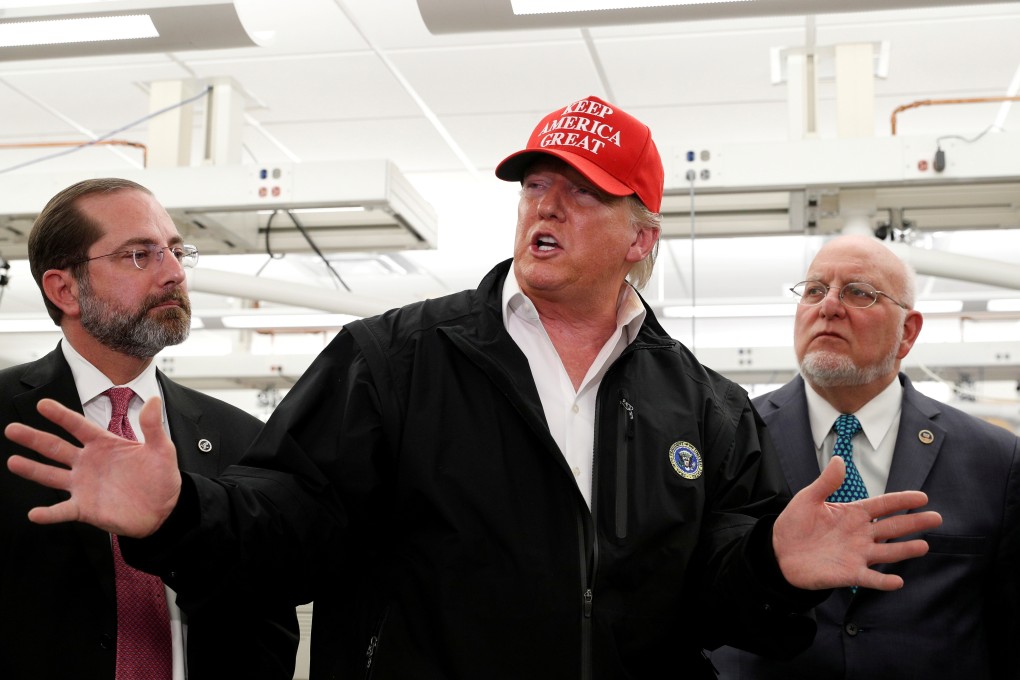 US President Donald Trump with Health and Human Services Secretary Alex Azar (left) and Centres for Disease Control and Prevention Director Robert Redfield in Atlanta, Georgia, last week. Photo: Reuters