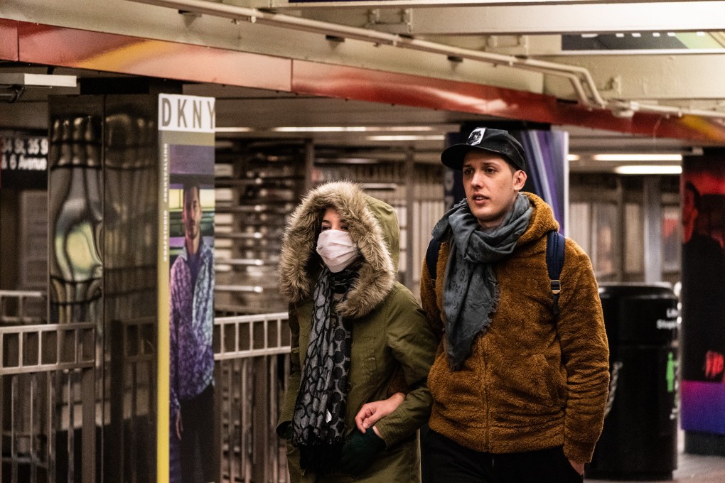 A pedestrian wears a protective mask while walking in the subway in New York on March 7, 2020. Such a sight would have been highly unusual before the spreading coronavirus. Photo: Bloomberg