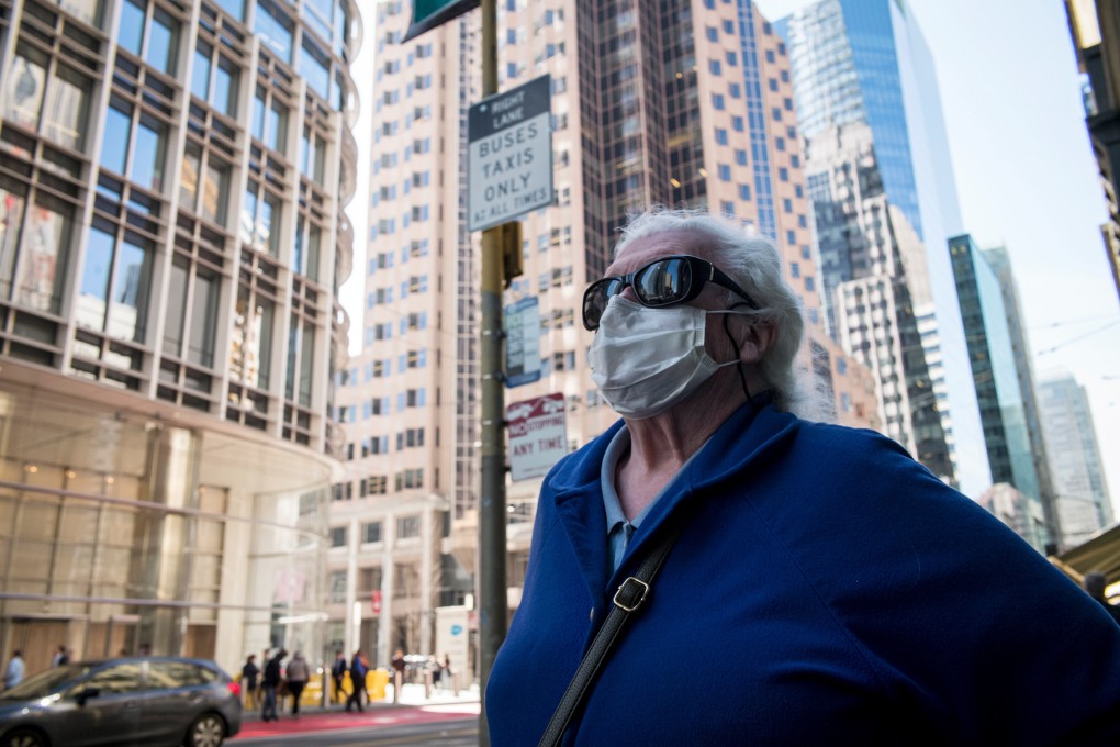 A pedestrian wearing a protective mask on the streets of San Francisco. Photo: Bloomberg