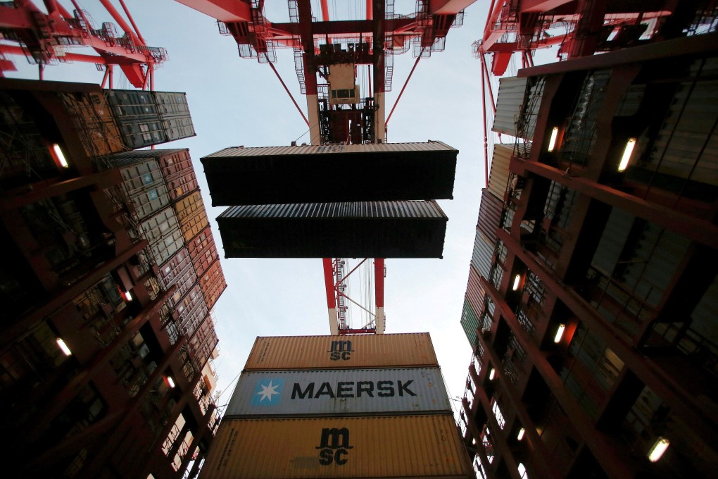 Containers are seen unloaded at the Yangshan Deep Water Port, part of the Shanghai Free Trade Zone, in Shanghai, China. Photo: Reuters