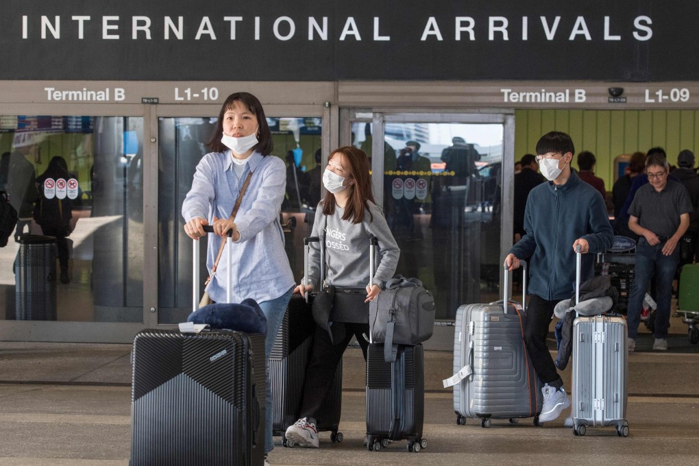 Passengers arrive on a flight from Asia at Los Angeles International Airport, California. Photo: AFP