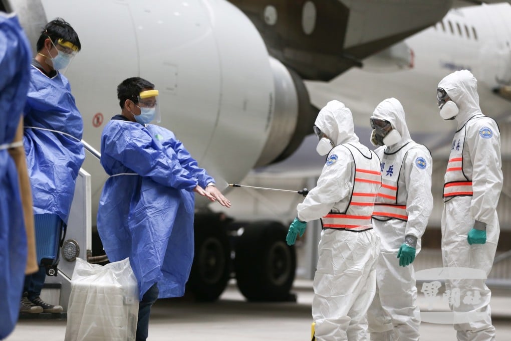 The passengers were met off the plane by soldiers from the 33rd Chemical Warfare Group. Photo: EPA-EFE