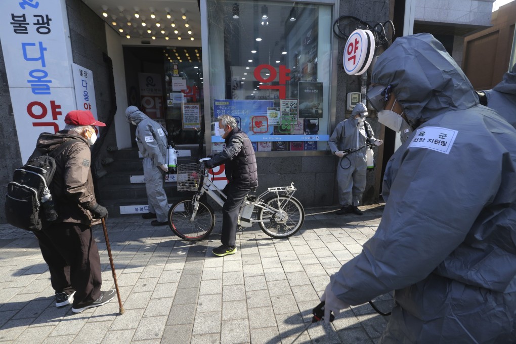 Soldiers spray disinfectant on a Seoul street. From the psychiatric ward of a hospital to a group home for the disabled, the coronavirus outbreak in South Korea is shedding new light on how the country’s mentally ill, disabled and elderly are treated. Photo: AP