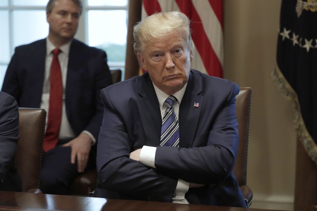 US President Donald Trump meets with bankers at the White House on Wednesday to discuss the coronavirus response. Photo: EPA-EFE