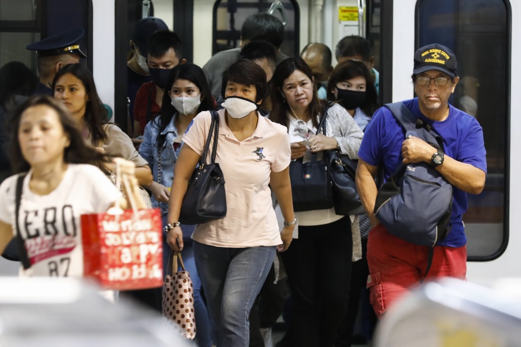 Passengers disembark from the metro in the Philippines. Photo: EPA