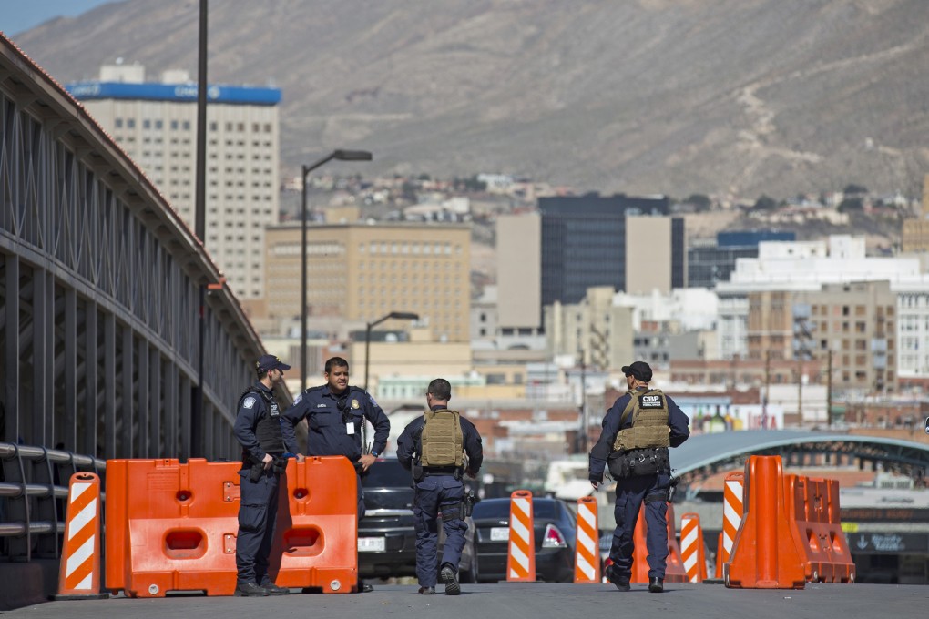 US customs officials patrol at an entry point in El Paso, Texas. A young woman died after falling while trying to climb the border wall near El Paso. Photo: AP