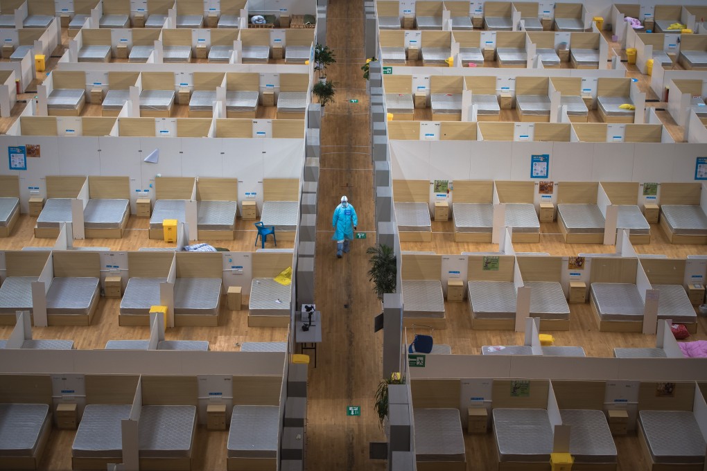 A staff member cleans up a makeshift hospital in Wuhan in central China’s Hubei province on March 8. The hospital, converted from a sports venue, was officially closed on Sunday after its last batch of cured Covid-19 patients were discharged. Photo: Xinhua