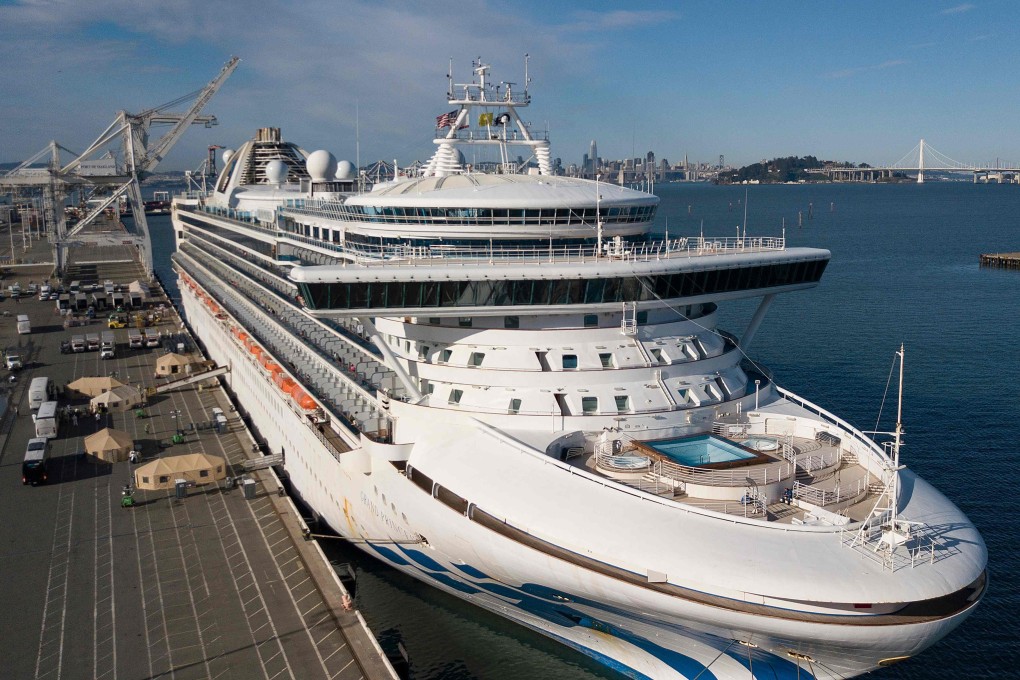 Medical personnel help load passengers onto buses as they disembark from the Grand Princess cruise ship at the Port of Oakland in California on Tuesday. Photo: AFP