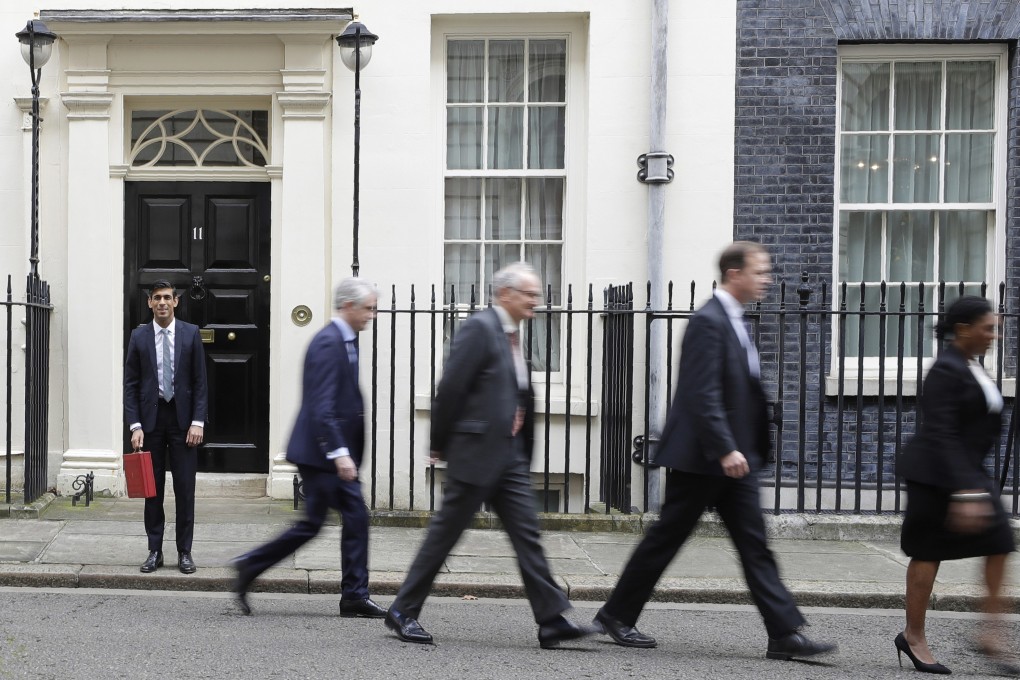 Britain’s Chancellor of the Exchequer Rishi Sunak (left) and his ministerial team prepare to leave No 11 Downing Street for the House of Commons, where he will unveil Britain’s first budget since it left the EU. Photo: AP
