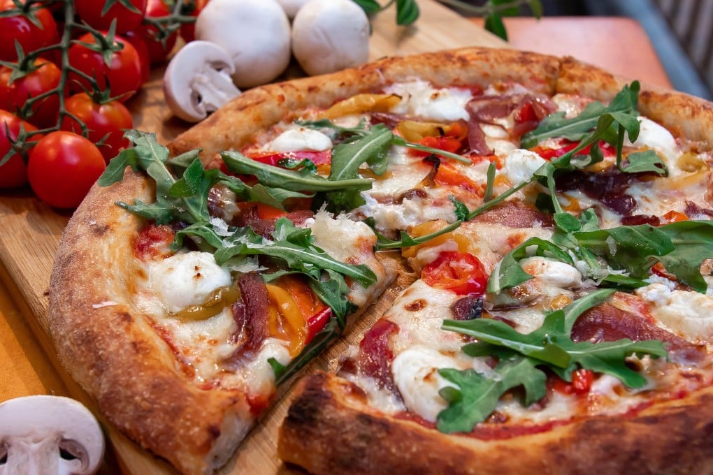 Dough Bros vegetarian ‘sophisticated’ pizza has tomato, mozzarella, caramelised onions, pickled peppers, sweet peppers and goat’s cheese. Photo: The Pizza Project