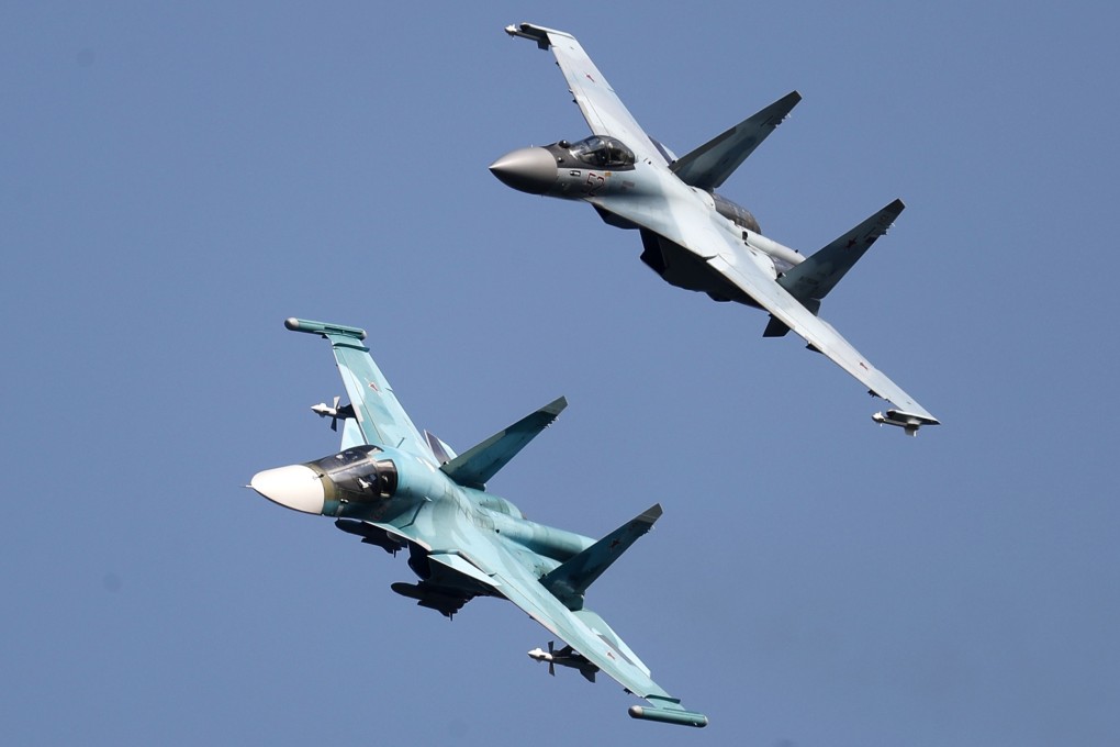 Russian Sukhoi Su-35 jet (top) and Sukhoi Su-34 bomber perform during the MAKS 2019 International Aviation and Space Salon in Zhukovsky outside Moscow. Photo: EPA-EFE