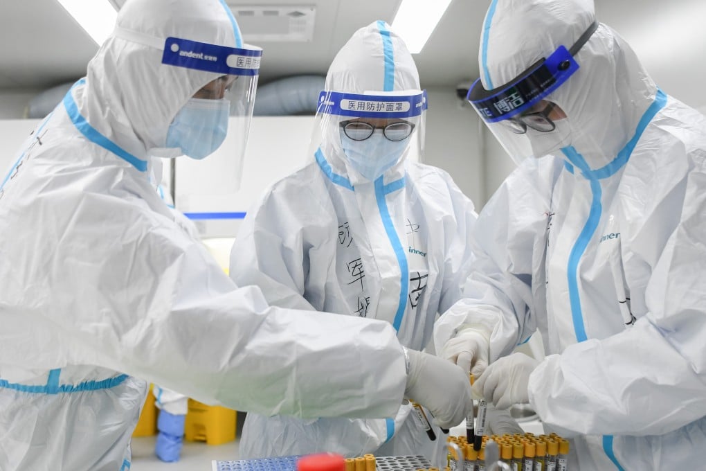 Medical professionals test samples from Covid-19 patients for diagnostic work at Zhongnan Hospital of Wuhan University in Hubei province. Photo: Xinhua