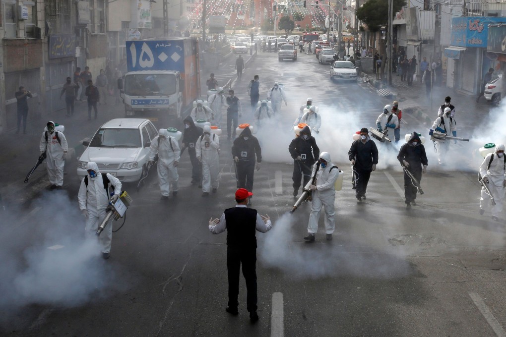 Iranian firefighters disinfect streets in the capital Tehran in a bid to halt the spread of coronavirus. Photo: AFP