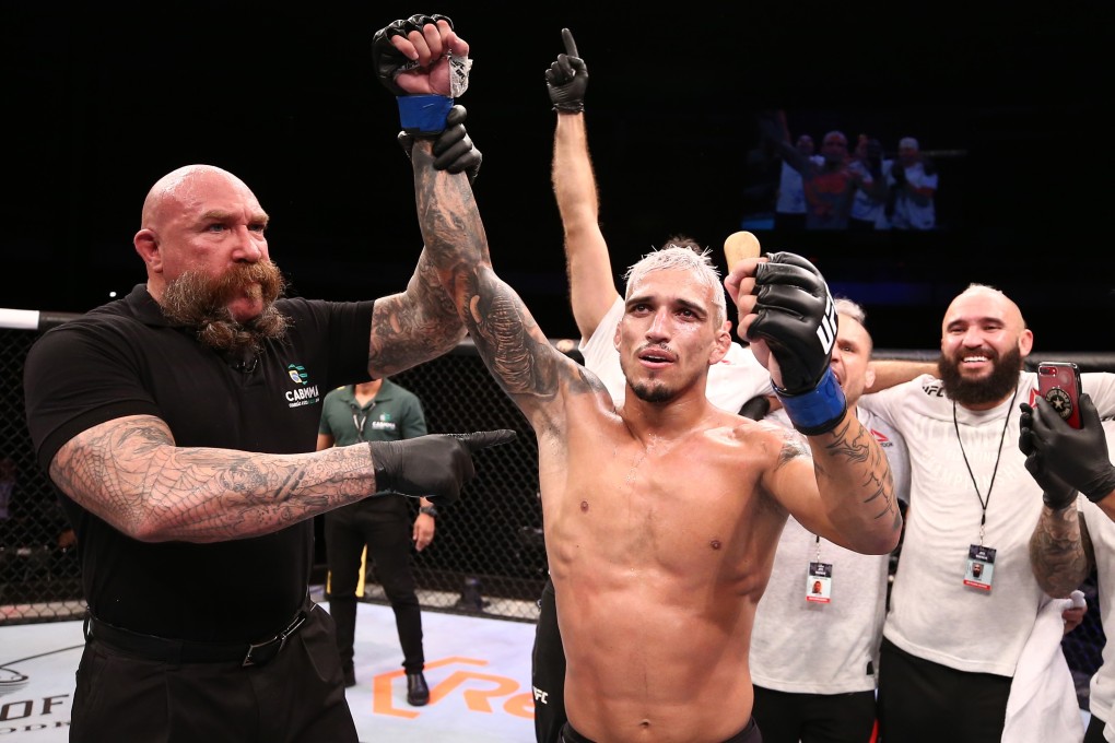 Charles Oliveira of Brazil celebrates after his submission victory over Kevin Lee. Photo: Buda Mendes/Zuffa LLC)