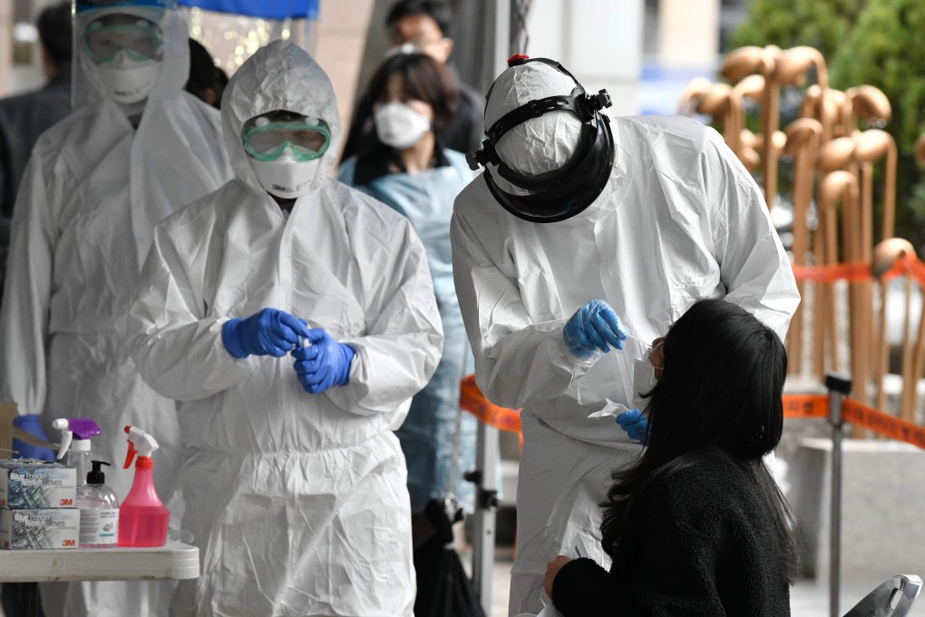 Medical workers take swabs to test for Covid-19 in Seoul. South Korea has mounted an extensive coronavirus testing regime. Photo: AFP