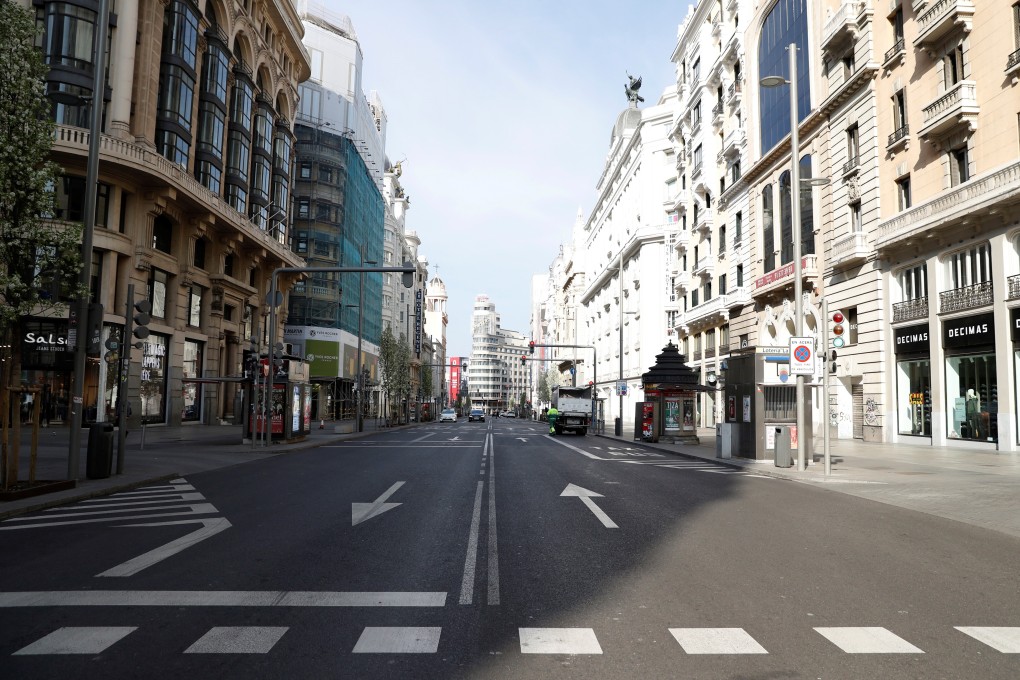 The usually bustling Gran Via in Madrid is deserted on Sunday, a day after the Spanish government announced a lockdown. Photo: EPA-EFE