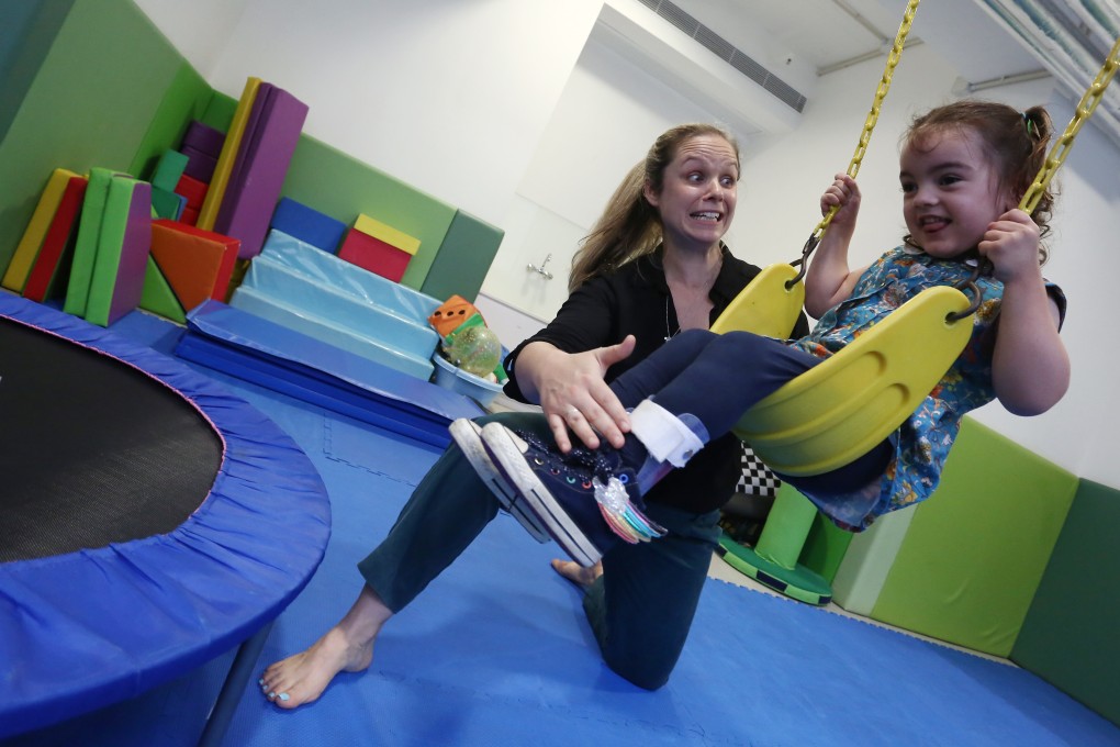 Jessica Tuohy (left), clinical director at therapy centre Spot, with four-year-old Kara Blaauw. Photo: Jonathan Wong