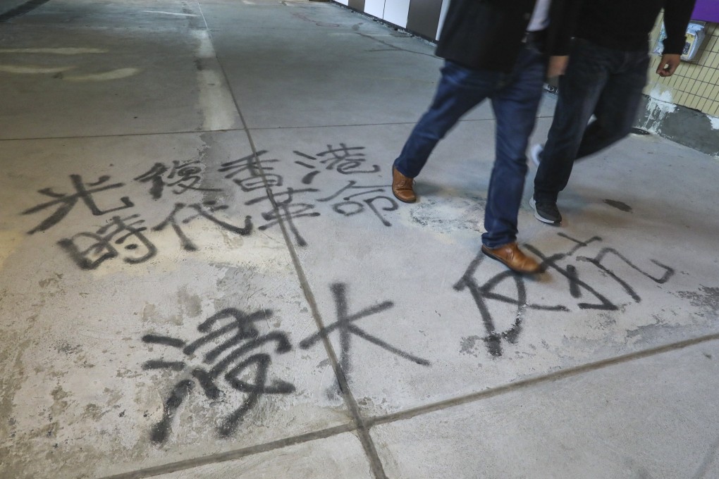 Anti-government slogans on a footpath in the Baptist University’s Kowloon Tong campus on January 13, as a new term begins at the university in Hong Kong. Photo: Felix Wong
