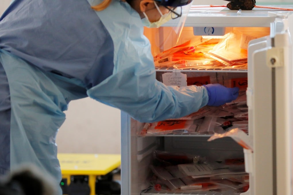 A medical worker stores test kits at a drive-through testing site for coronavirus for employees at UW Medical Center Northwest in Seattle. Photo: Reuters