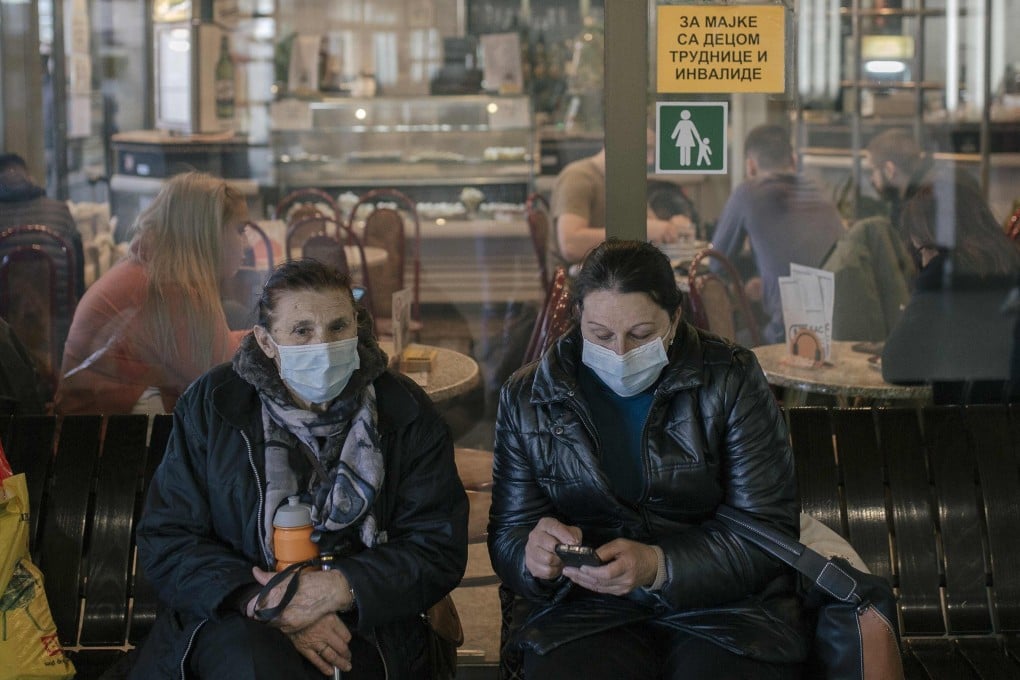 Women in face masks at Belgrade's main bus station, one day after Serbia declared a state of emergency to halt the spread of the new coronavirus. Photo: AFP