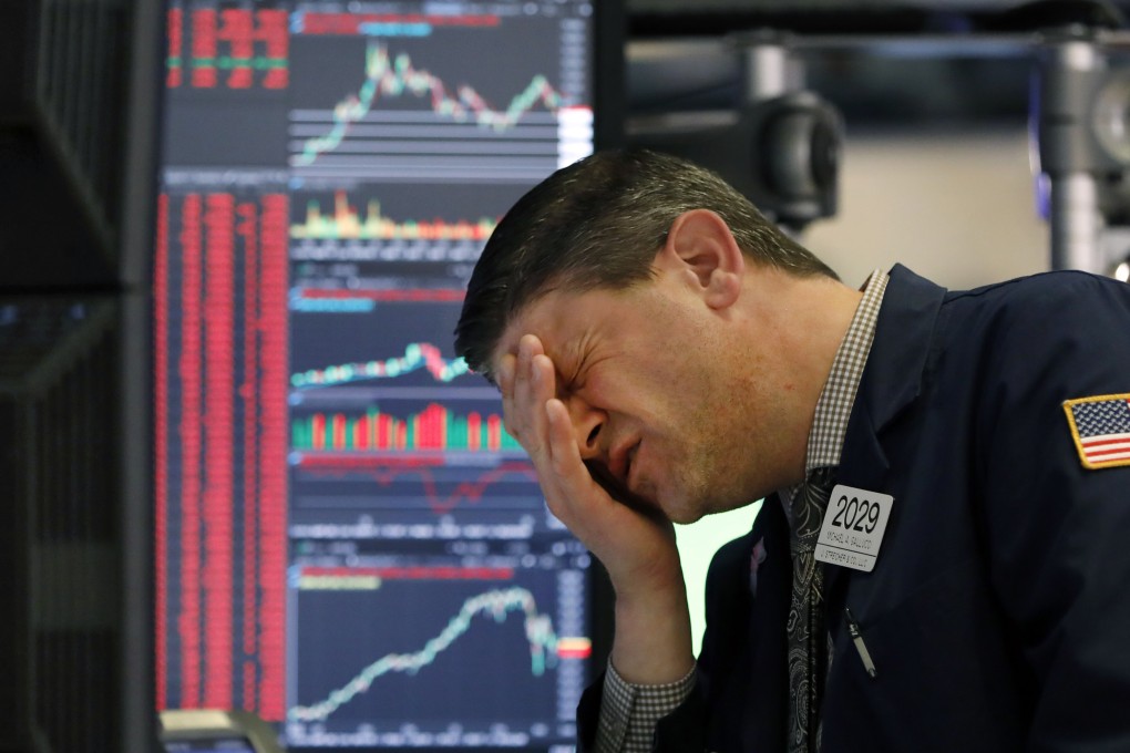 A trader reacts to news on the floor of the New York Stock Exchange on March 11. Photo: AP