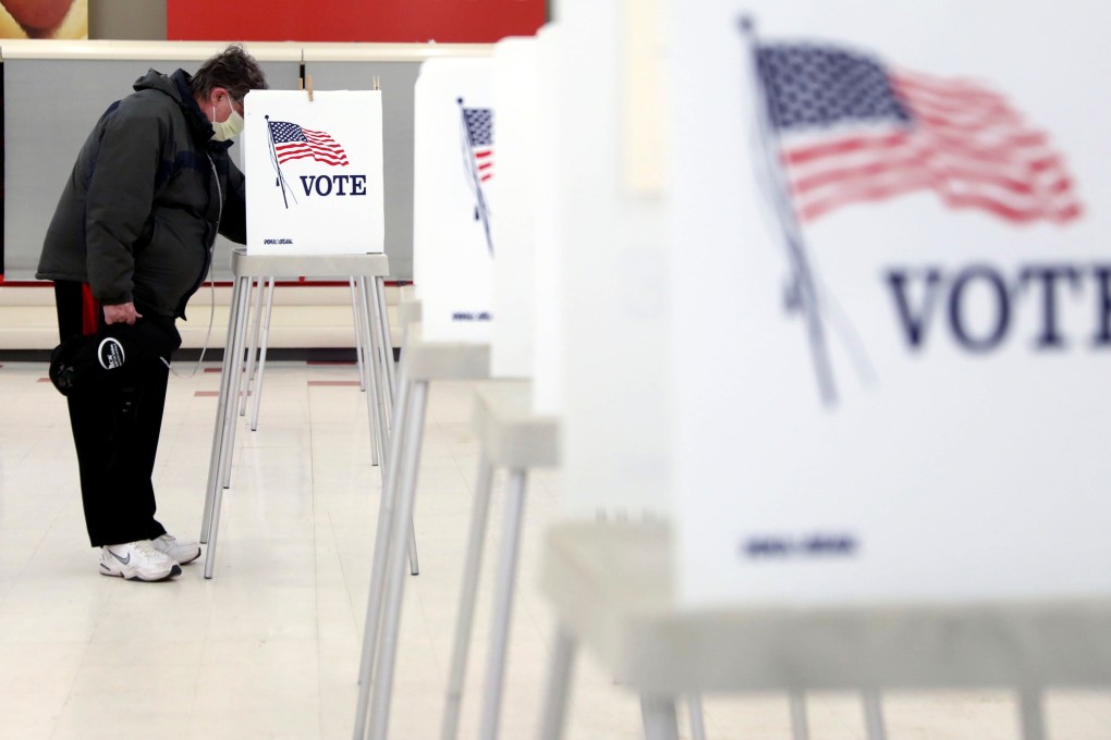 A voter fills out his ballot during the primary election in Ottawa, Illinois, on Tuesday. Photo: Reuters