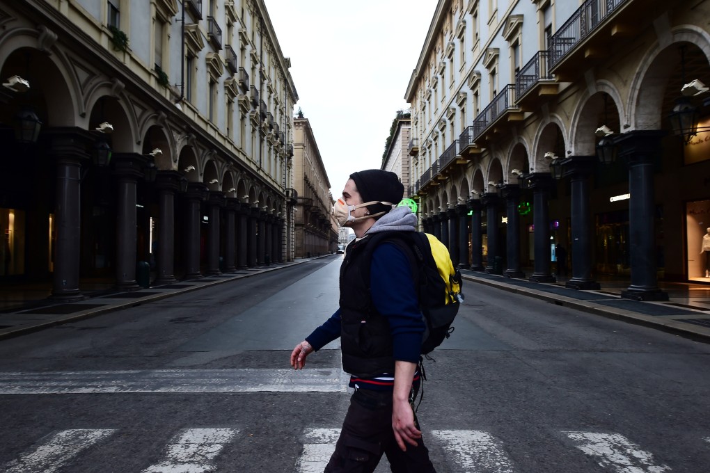 A virtually deserted Via Roma, the main shopping street in Turin, Italy, on March 12, the third day of an unprecedented countrywide lockdown aiming to slow the spread of the novel coronavirus causing Covid-19. Photo: Reuters