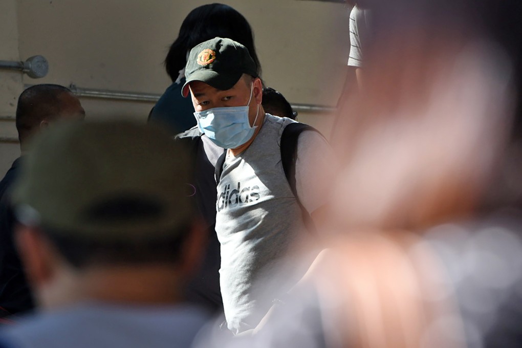A man arrives at the Woodlands checkpoint in Singapore, after crossing the causeway connecting the city state to Malaysia. Photo: AFP