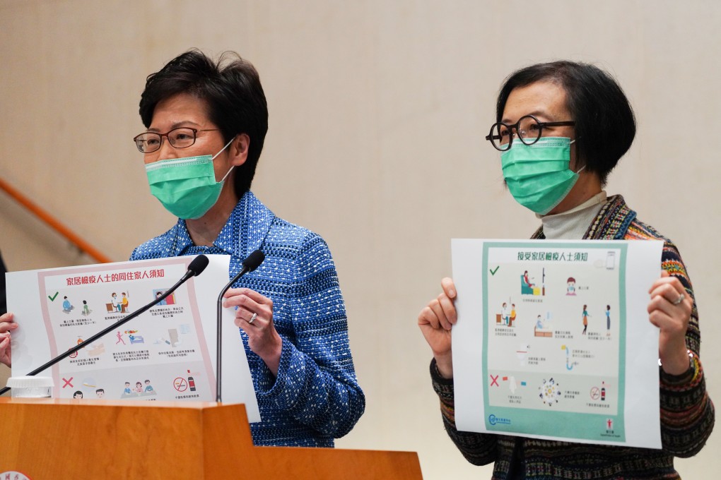 Carrie Lam (left) and Secretary for Food and Health Sophia Chan Siu-chee highlight precautions to be taken if a family member contracts Covid-19 or when receiving a patient, at the Chief Executive’s Office in Admiralty on March 17. Photo: Robert Ng