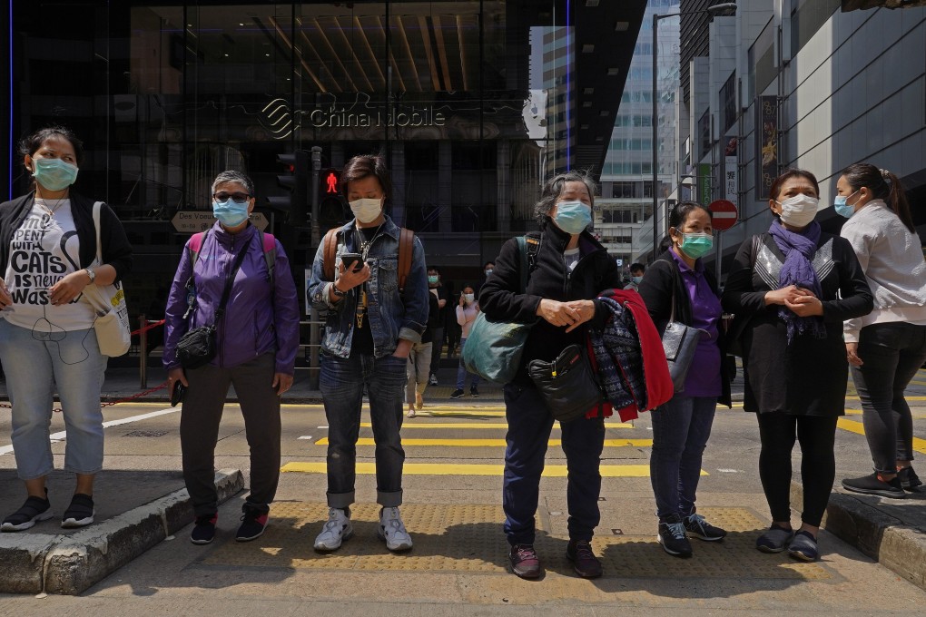 Face masks on every pedestrian in downtown Hong Kong on March 16, amid fears of coronavirus contagion. Photo: AP
