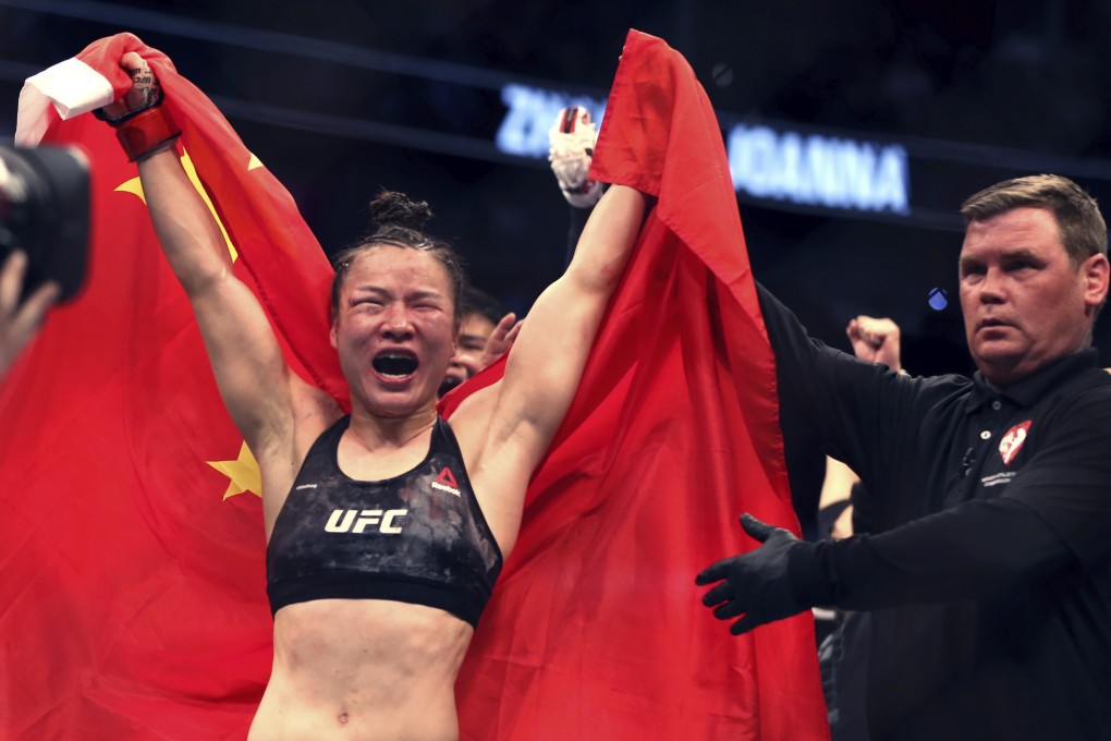 Zhang Weili celebrates her win by split decision over Joanna Jedrzejczyk in the women’s strawweight championship bout at UFC 248. Photo: AP