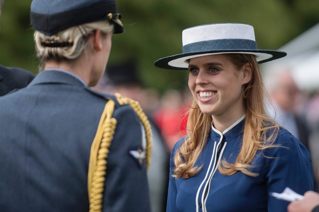 Britain’s Princess Beatrice greets guests at a garden party at Buckingham Palace in May 16, 2017. Photo: AFP