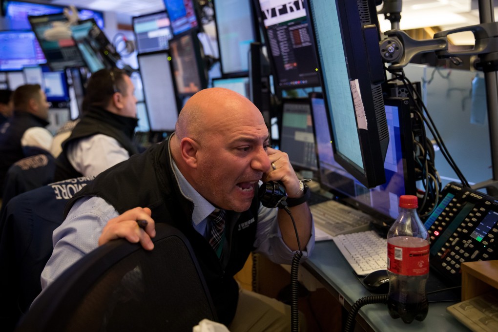 Traders work at the New York Stock Exchange on Wednesday. Photo: Xinhua