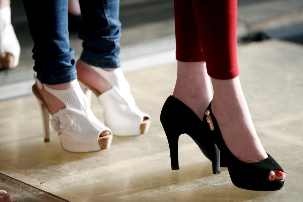 Participants wait to practise their catwalk at a beauty pageant in Nairobi, Kenya, in 2018. High heels are often mistakenly blamed for causing bunions. Photo: Reuters