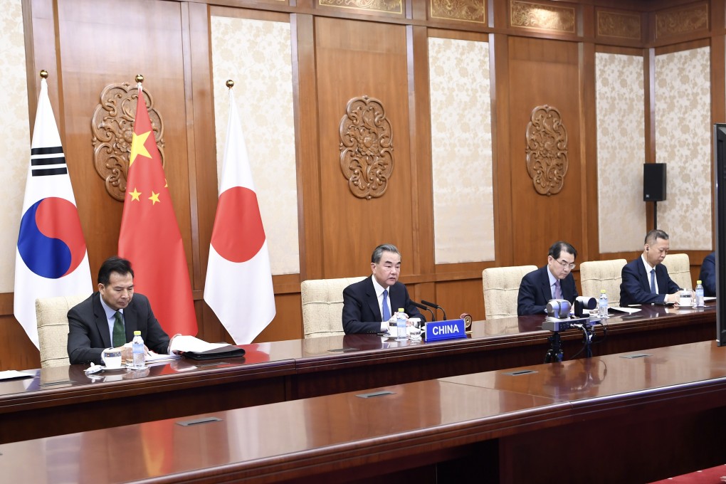 Chinese Foreign Minister Wang Yi during the teleconference with his South Korean and Japanese counterparts. Photo: Xinhua