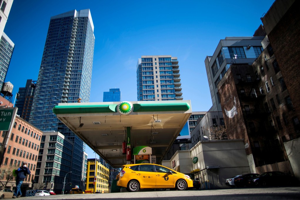 A taxis fills up at a petrol station in New York. Oil prices have been falling as global demand has been slumping because of the coronavirus pandemic. Photo: Reuters