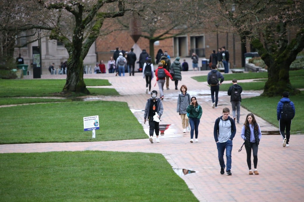 Students at the University of Washington are seen on campus for the last day of in-person classes on March 6. Photo: Getty Images via AFP