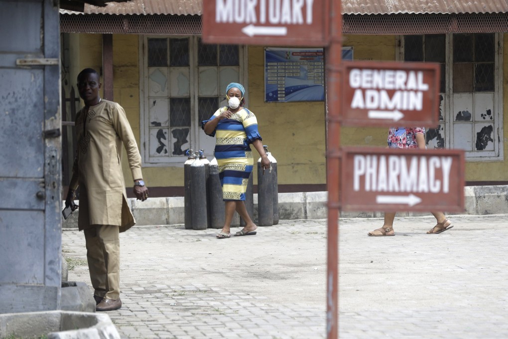 People walk inside the Yaba Mainland hospital compound where Covid-19 patients are being treated in Lagos, Nigeria, in February. Photo: AP