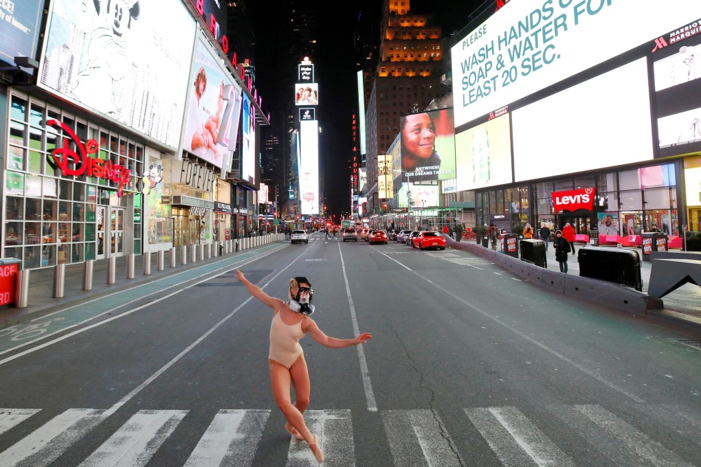 Ballerina Ashlee Montague wore a gas mask while dancing in the nearly deserted Times Square on Wednesday as the coronavirus outbreak continued to shut down New York City. US-China relations are fraying even further over accusations from each side that the other is responsible for the pandemic. Photo: Reuters