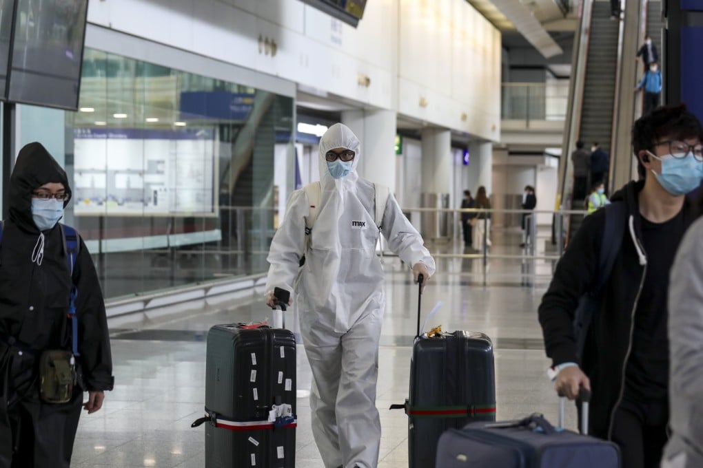 Arrivals into Hong Kong International Airport take precautions on Saturday as dozens more test positive for the coronavirus. Photo: Xiaomei Chen