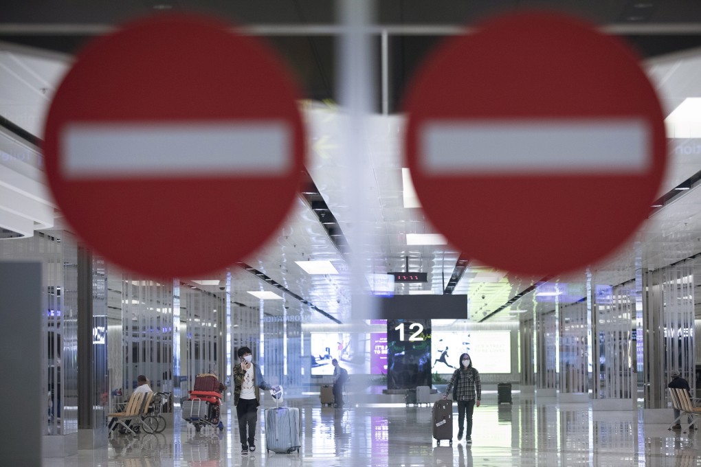 Travellers are seen through the arrival gates of Singapore’s Changi Airport on Thursday. Photo: EPA