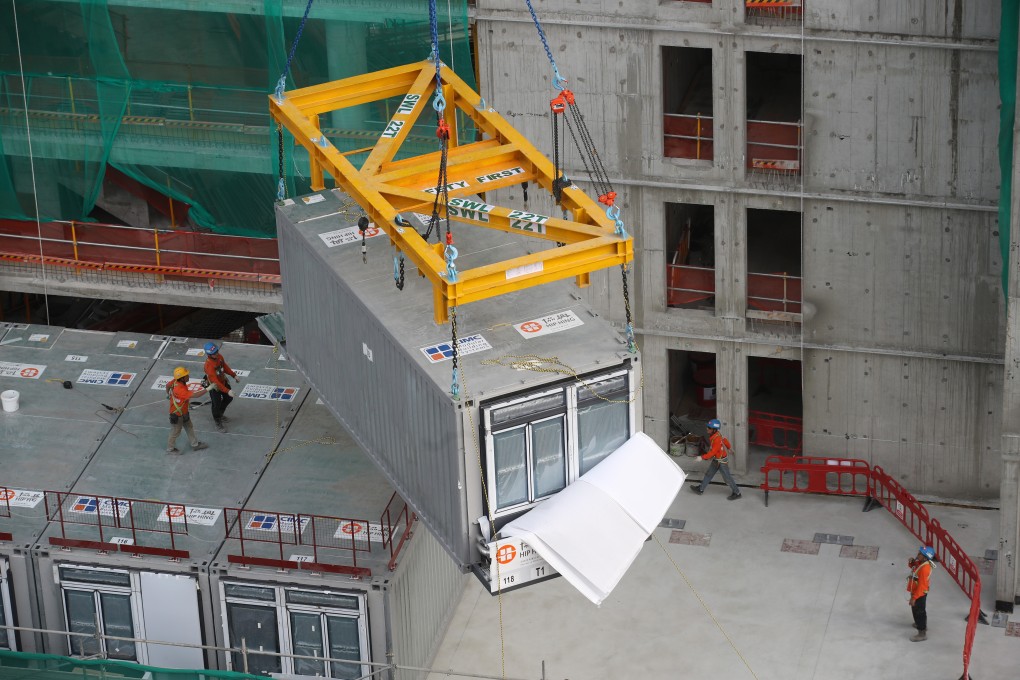 Prefabricated units are stacked by crane, eliminating the need for Hong Kong construction workers to clamber on high scaffolding, a key concern as workers in the sector age. Photo: Winson Wong