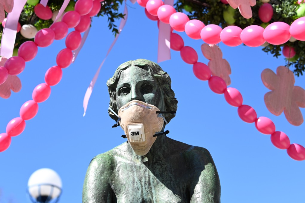 A face mask placed on The Nymph fountain in Bad Wildungen. Germany has introduced drastic restrictions on public life and strict travel bans as part of efforts to curb the spread of the coronavirus. Photo: DPA