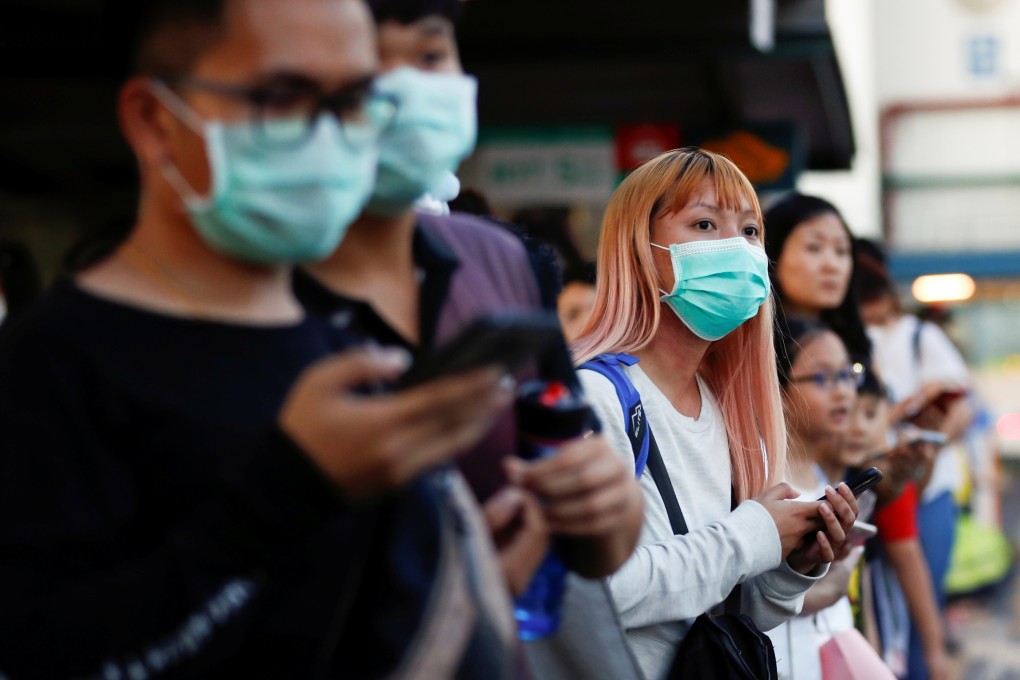 Commuters wait to leave the Woodlands Causeway across to Singapore from Johor, hours before Malaysia imposes a lockdown on travel. Photo: Reuters