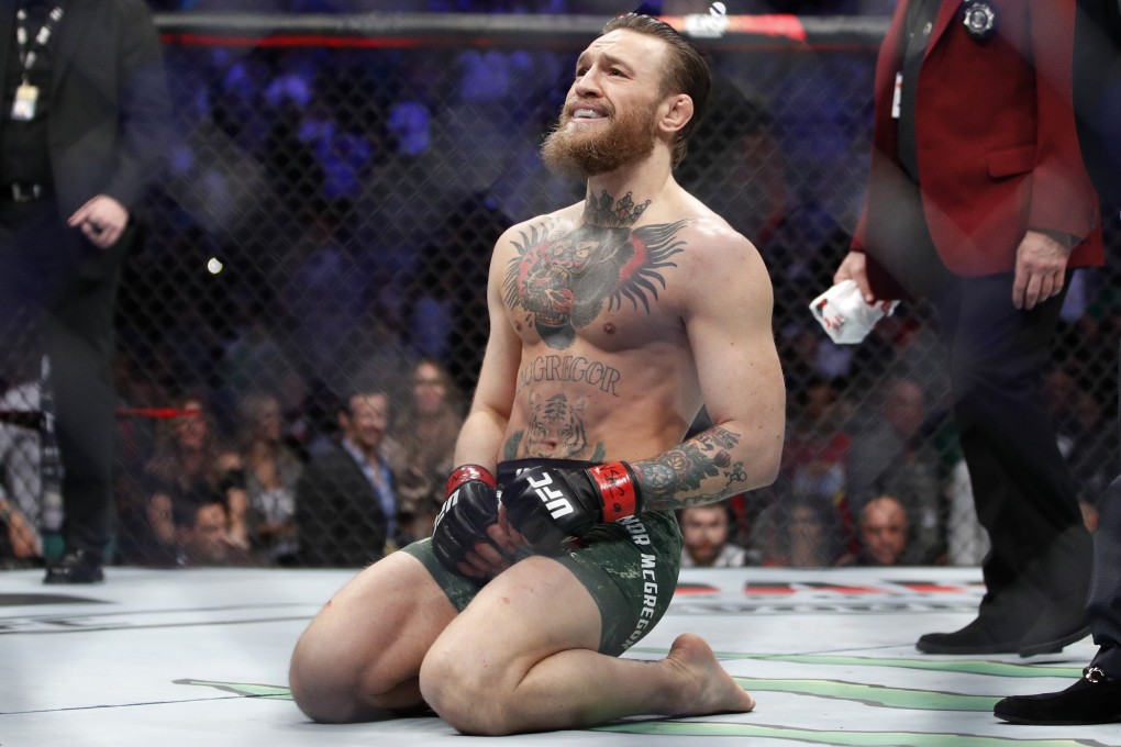 Conor McGregor kneels in the Octagon after he defeats Donald Cerrone at UFC 246 in Las Vegas in January. Photo: AP
