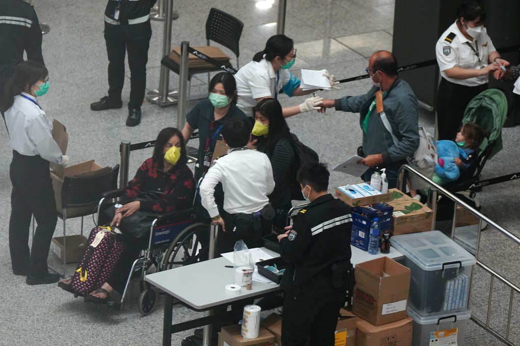 Travellers arriving at Hong Kong International Airport are questioned by Department of Health staff. Photo: Sam Tsang